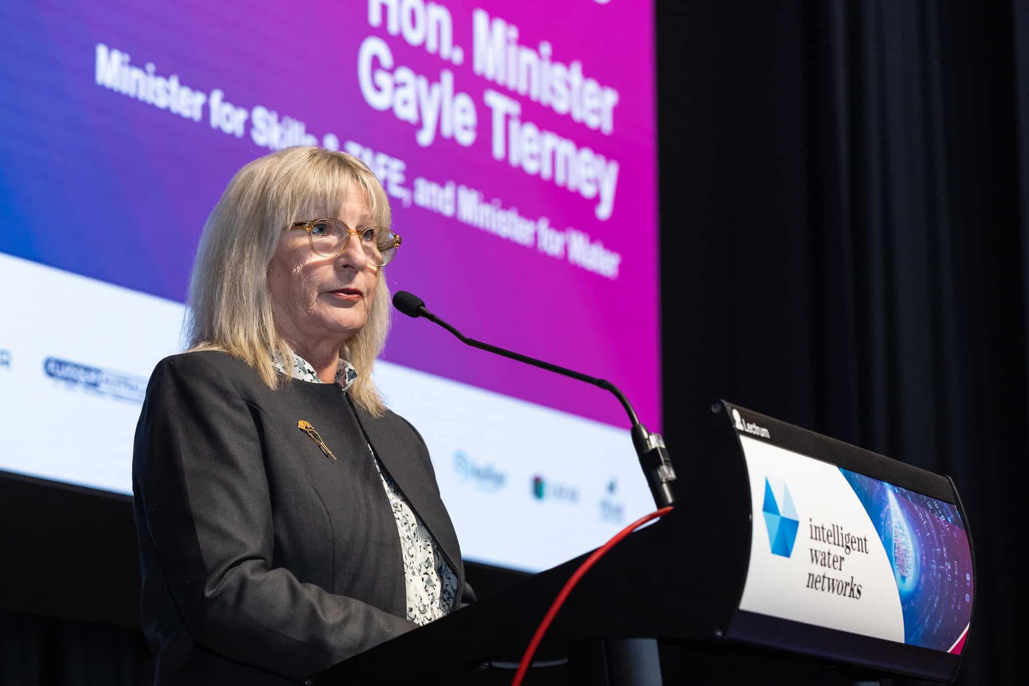 Minister at lectern – clear